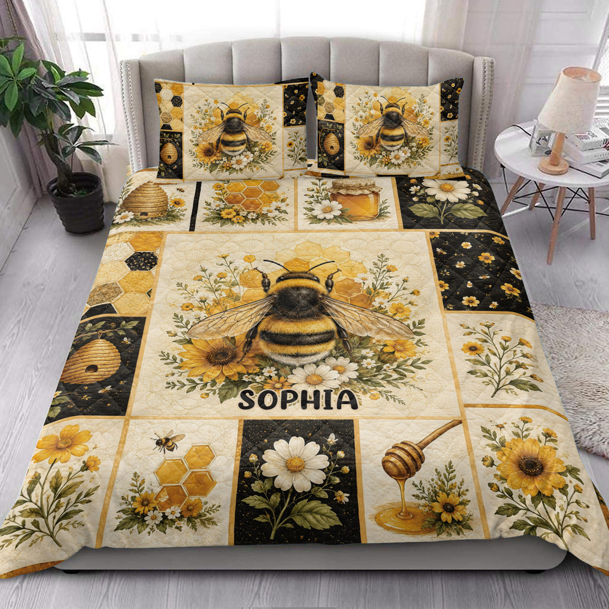 Bee quilt blanket styled in a bright bedroom with honeybees, flowers, honeycomb, and honey artwork