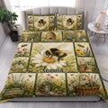 Bee quilt blanket styled in a bright bedroom with floral garden artwork and matching bee pillows