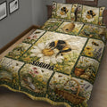 Bee quilt bedding set in a bedroom featuring a large bumblebee, flowers, beehive, and garden basket scenes