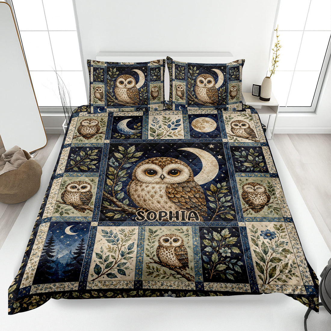 Owl quilt blanket bedding set displayed on a bed with moon, stars, botanical leaves, and woodland owl artwork