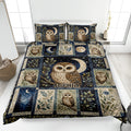 Owl quilt blanket bedding set displayed on a bed with moon, stars, botanical leaves, and woodland owl artwork