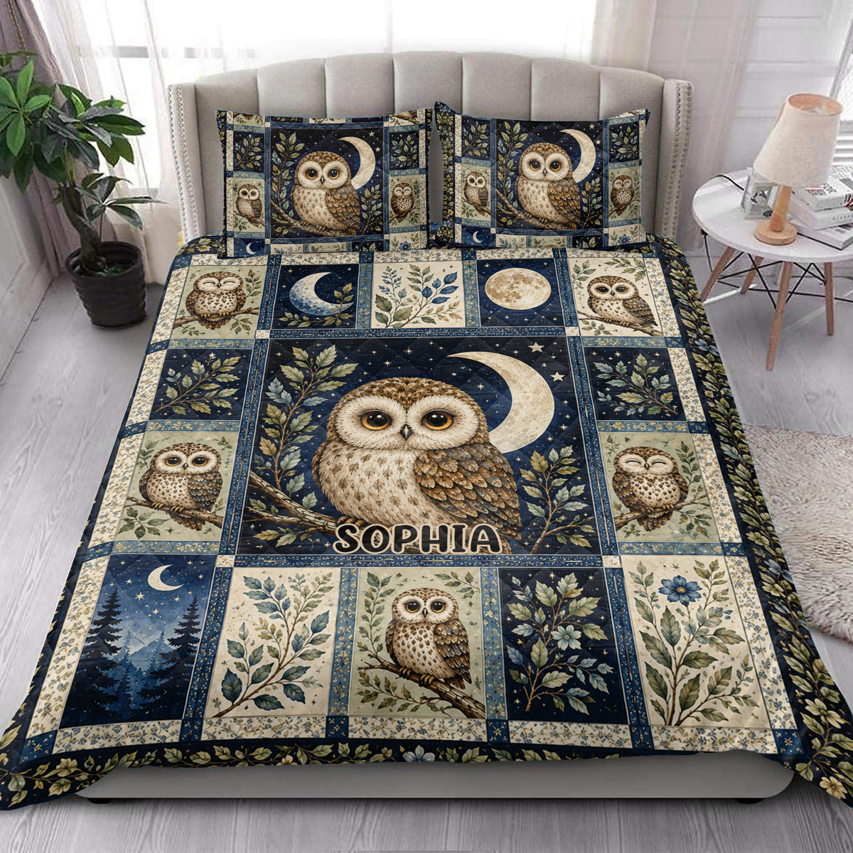 Moonlit owl quilt blanket styled in a bright bedroom with botanical panels and multiple owl illustrations