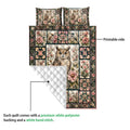 Owl quilt blanket detail showing the printed floral front, quilted white backing, and stitched construction
