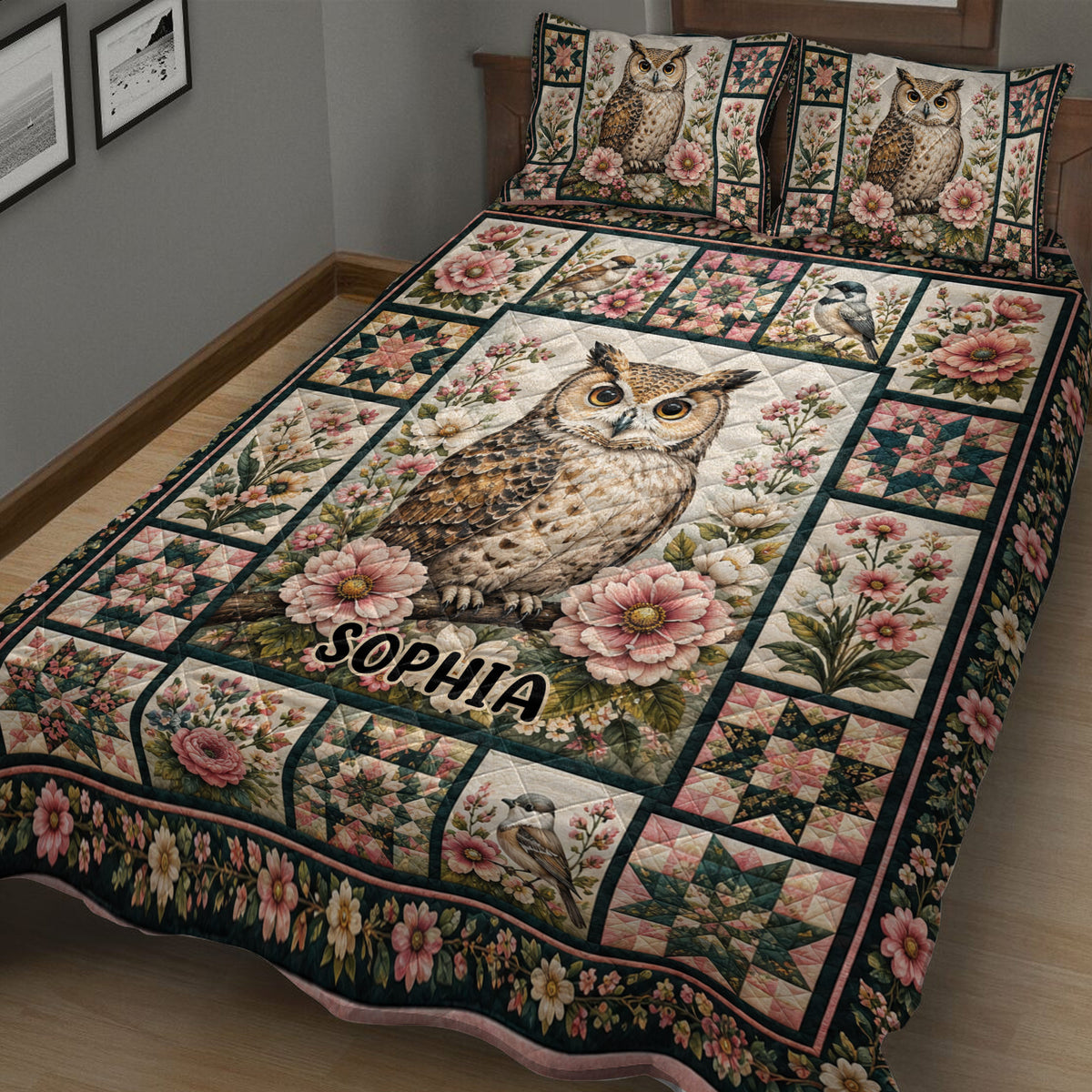 Close bedroom view of an owl quilt blanket with botanical flowers, small birds, and decorative patchwork panels