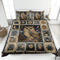 Owl quilt blanket displayed on a bed with moonlit birds, flowers, birdhouses, mushrooms, and navy botanical artwork