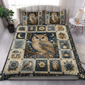 Owl quilt bedding styled in a bright bedroom with large owl artwork, flowers, birds, moons, and botanical panels