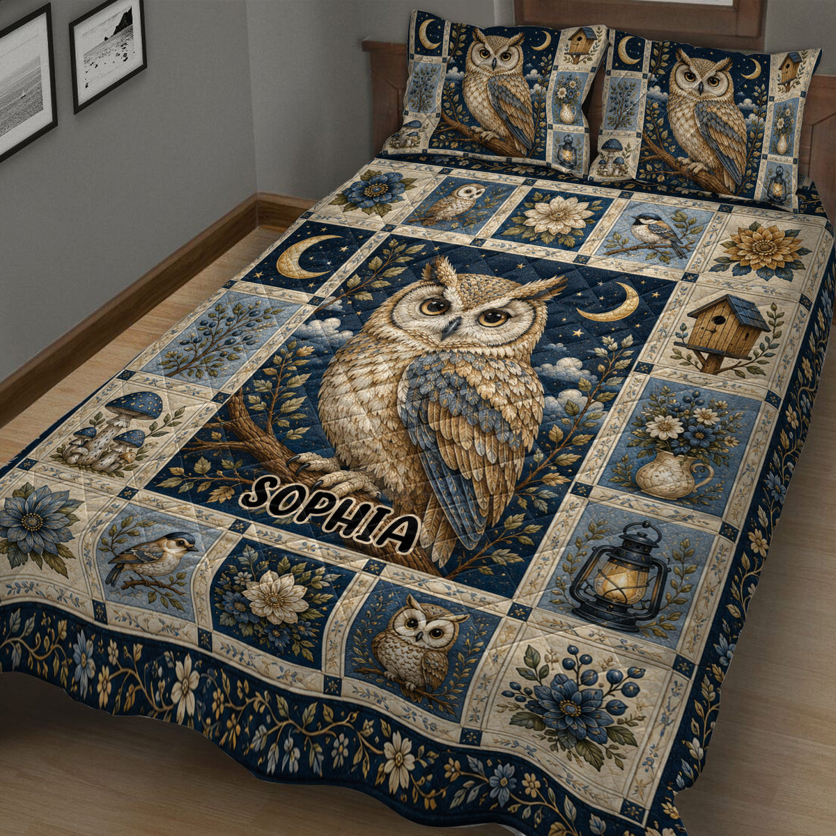 Close bedroom view of an owl quilt blanket with detailed owl artwork, flowers, lanterns, birdhouses, and deep blue tones