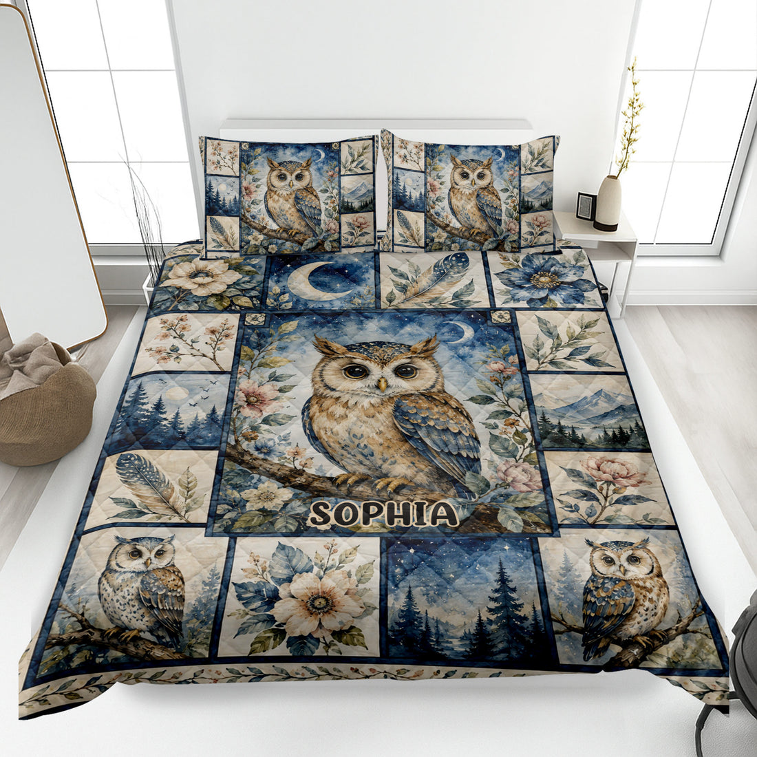 Owl quilt blanket displayed on a bed with floral, moonlit forest, mountain, and celestial artwork