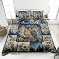 Owl quilt blanket displayed on a bed with floral, moonlit forest, mountain, and celestial artwork