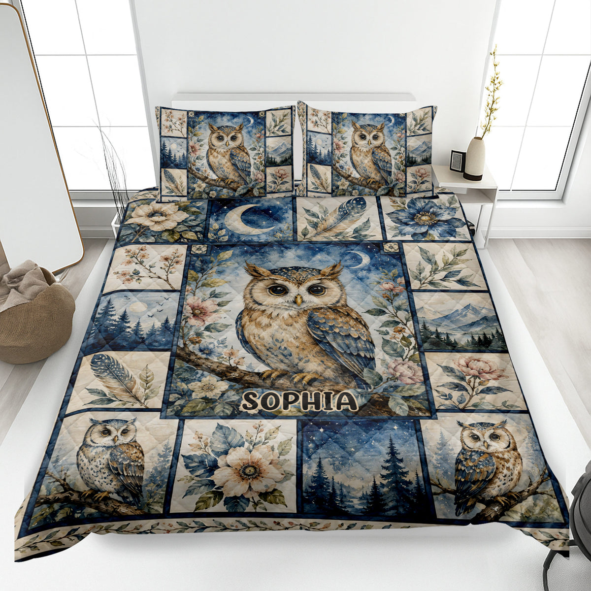 Owl quilt blanket displayed on a bed with floral, moonlit forest, mountain, and celestial artwork
