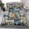 Owl quilt bedding styled in a bright bedroom with floral, mountain, moon, and forest panels