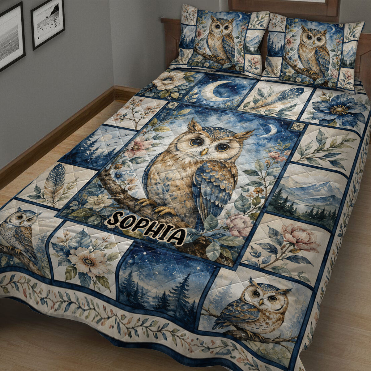 Close bedroom view of owl quilt blanket with celestial night sky, flowers, feathers, and mountain scenes