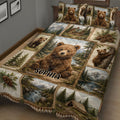 Close view of a bear quilt blanket featuring cubs, mountains, pine forests, a cabin, and a campsite