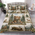 Bear quilt bedding set styled in a bright bedroom with forest animals, mountains, and pine trees