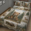 Rustic bear quilt blanket displayed on a bed with woodland scenery, wildlife, and forest cabin artwork