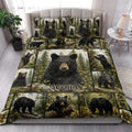 Bear quilt blanket styled on a bedroom bed with black bears, pine trees, and rustic woodland artwork