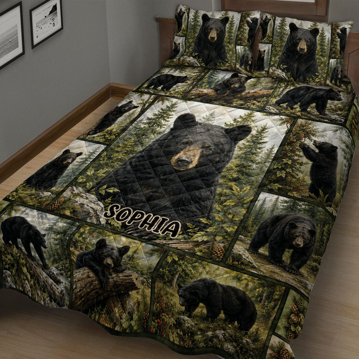 Close bedroom view of a bear quilt blanket with black bear scenes, trees, foliage, and woodland colors