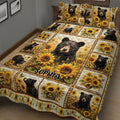 Close view of a bear quilt blanket featuring woodland bears, sunflowers, and rustic panel artwork