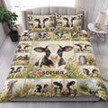 Dairy cow quilt blanket styled on a bright bedroom bed with floral countryside artwork