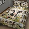 Close view of dairy cow quilt blanket with pastoral scenes, wildflowers, barns, and milk cans