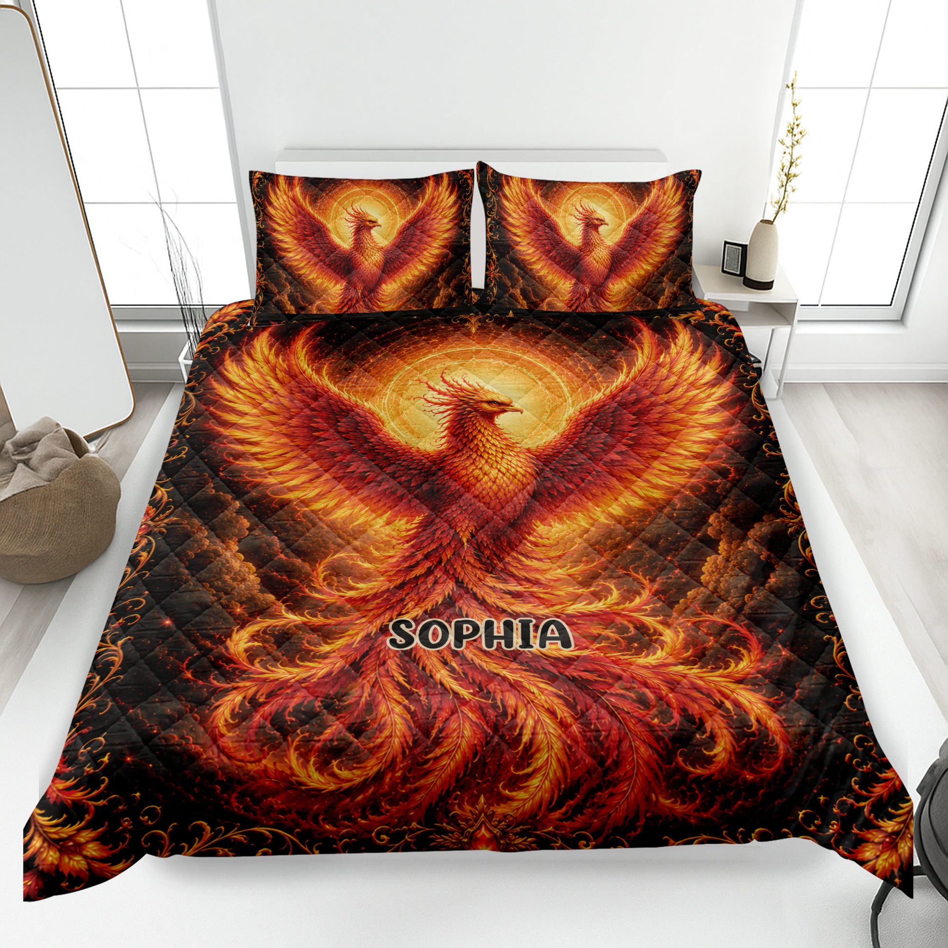 Phoenix quilt bedding set displayed on a modern bed with fiery red, orange, and gold artwork