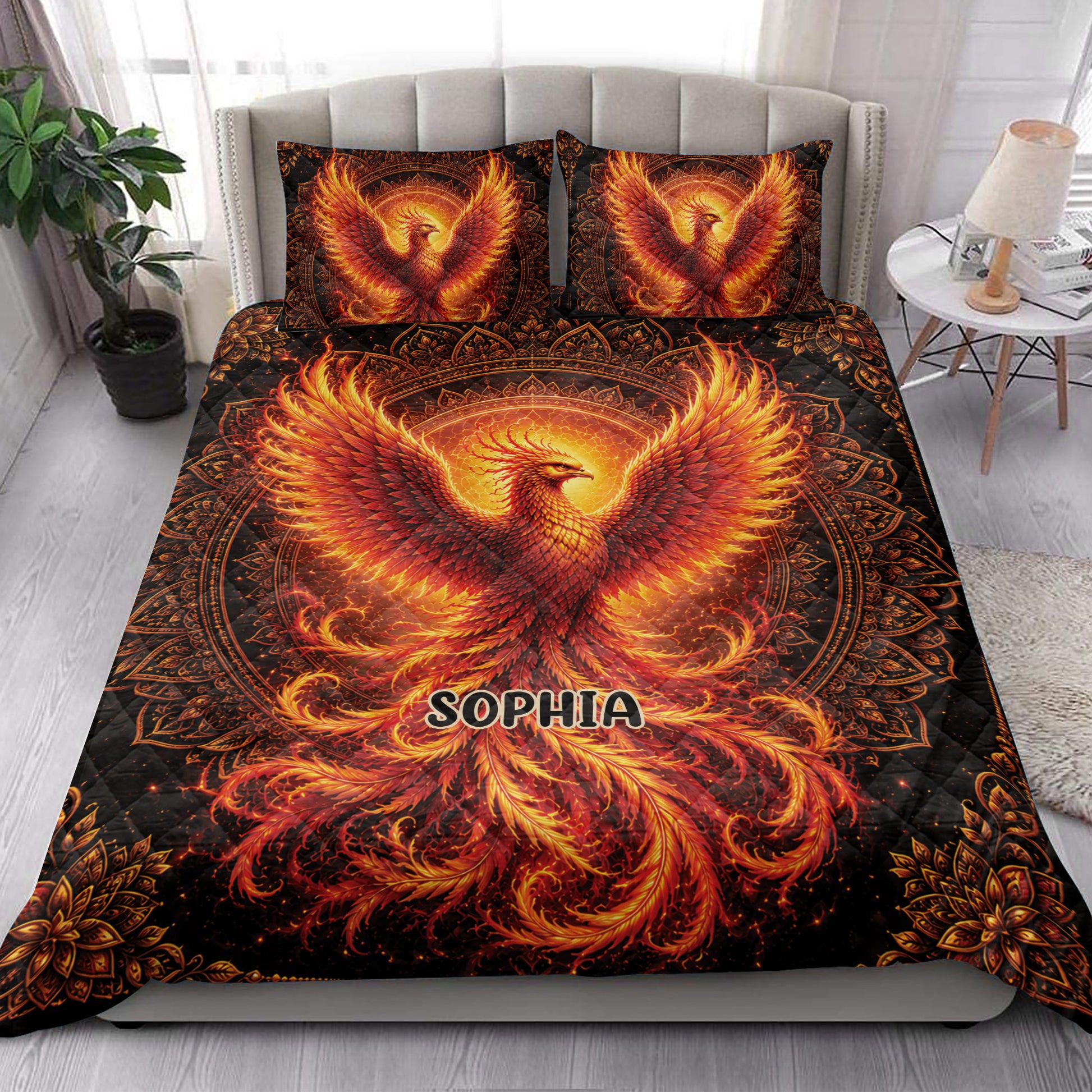 Phoenix quilt bedding set styled in a bright bedroom with dramatic orange, red and black artwork