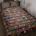 Bookcase quilt blanket spread across a bed with colorful bookshelves and a personalized design panel