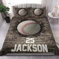 Baseball quilt blanket styled on a bedroom bed with large baseball artwork and bold sports-inspired design