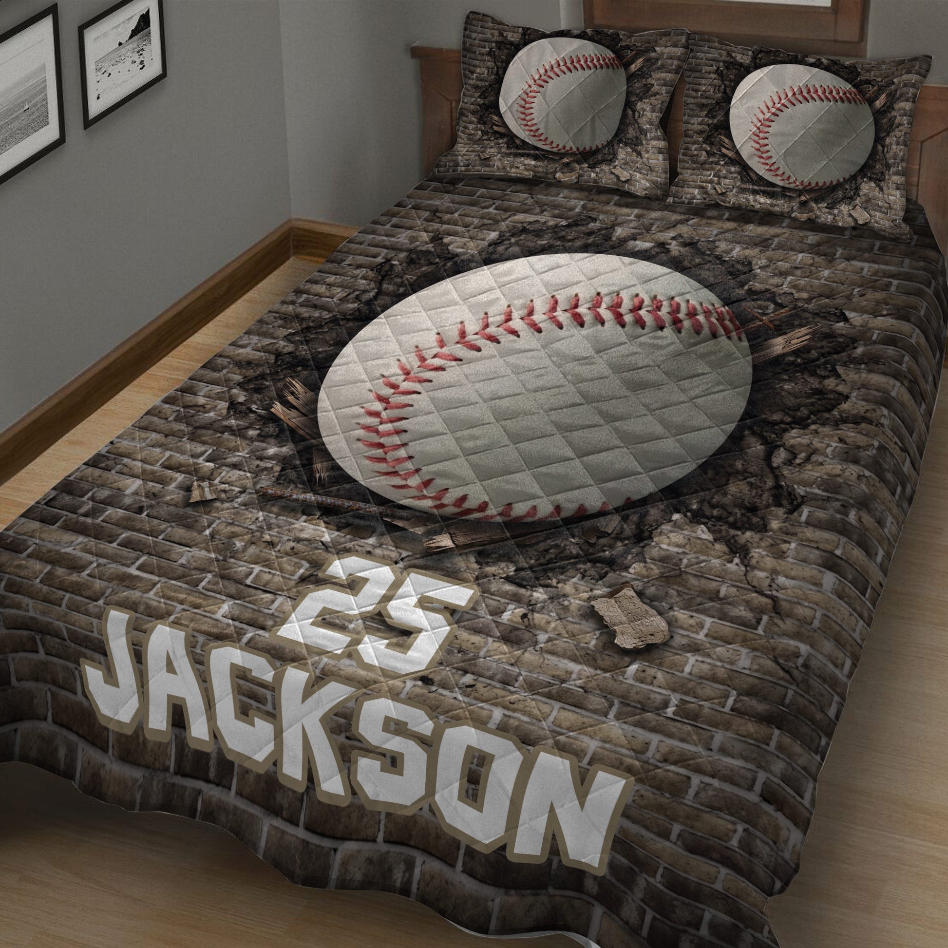 Close bedroom view of baseball quilt blanket with large stitched baseball artwork and rugged brick backdrop