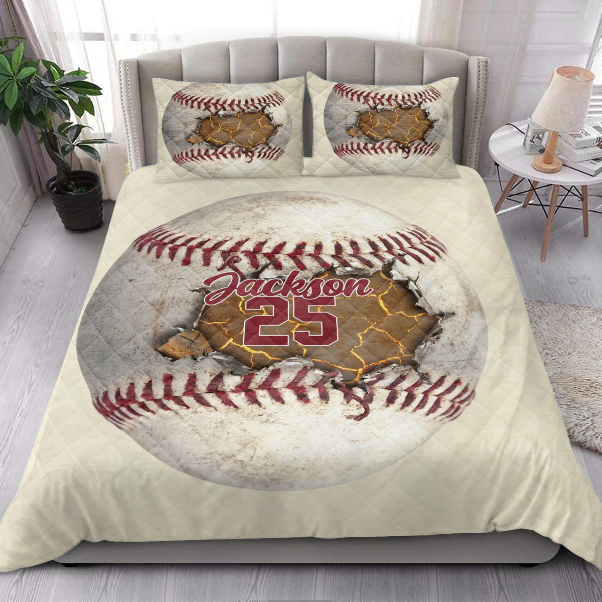 Baseball quilt blanket styled on a modern bed with oversized baseball artwork and matching decorative pillows