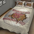 Baseball quilt bedding displayed in a bedroom with bold red stitching and dramatic cracked-ball artwork