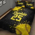 Close bedroom view of a black and yellow softball quilt with bold athletic artwork