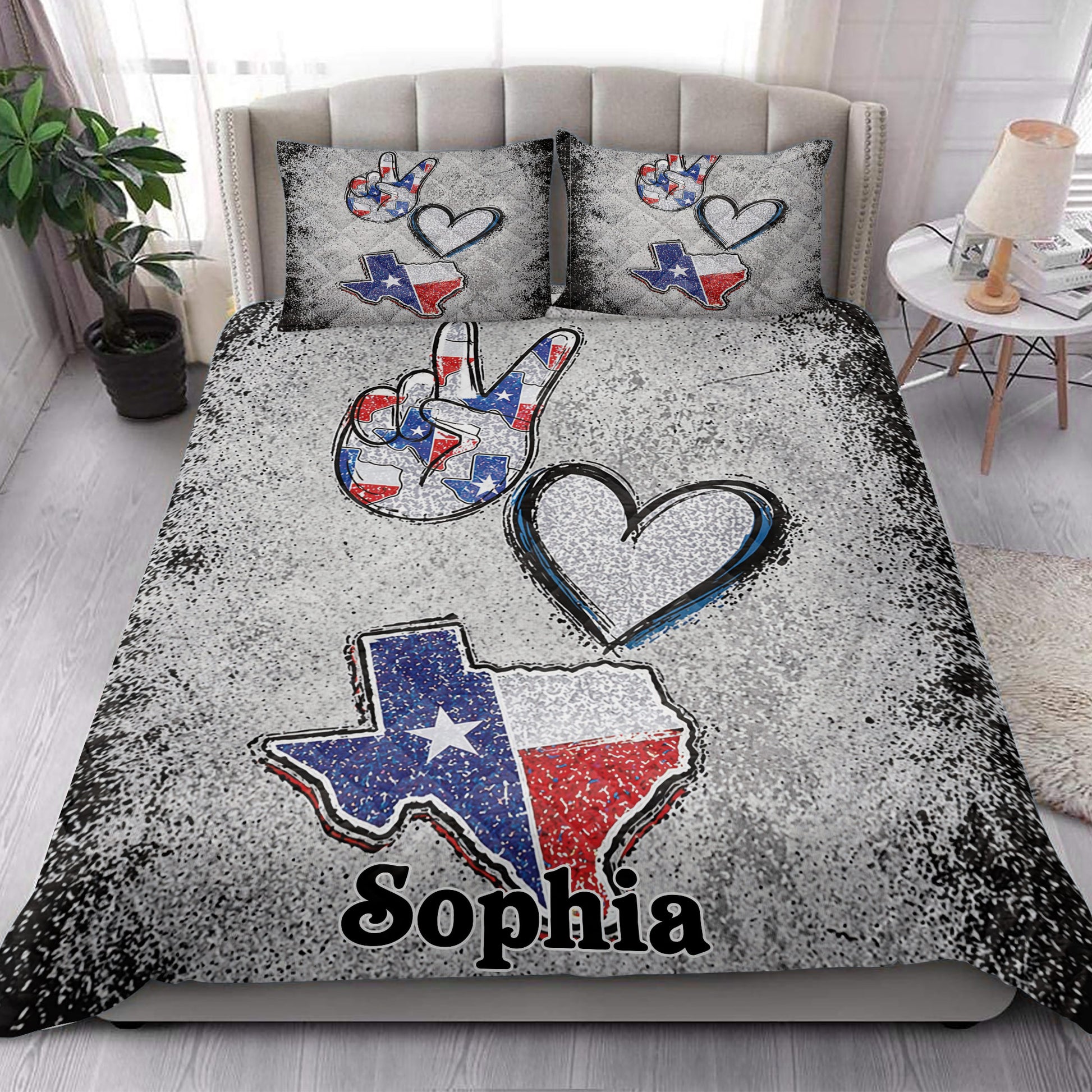 Texas quilt blanket styled in a bright bedroom with Texas outline artwork and patriotic colors