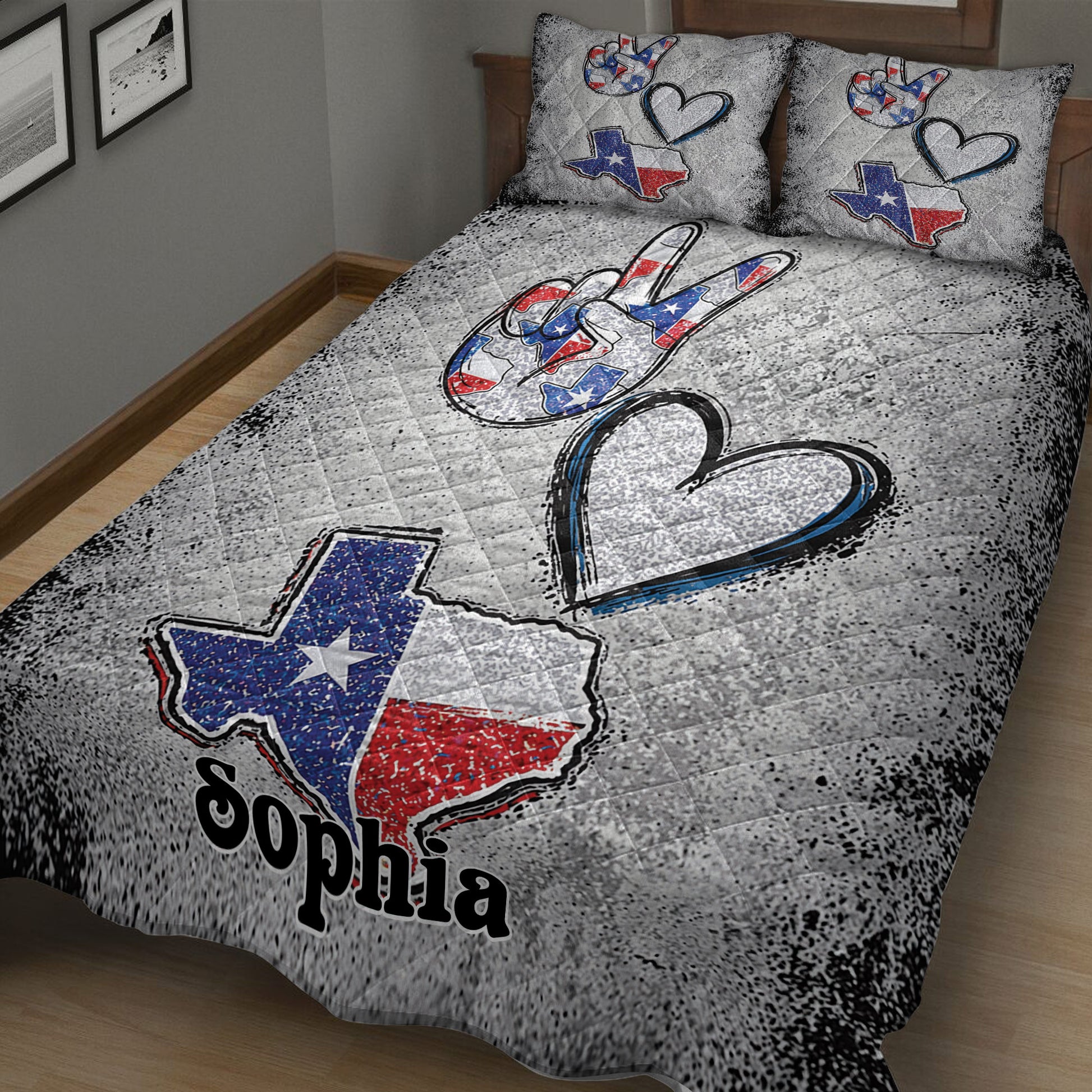 Angled bedroom view of a Texas quilt blanket with large hearts, peace hand artwork, and Lone Star colors