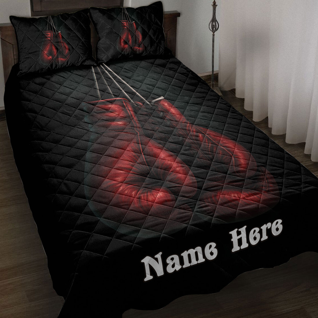 Black boxing quilt blanket displayed on a bed with dramatic red gloves and matching pillow artwork
