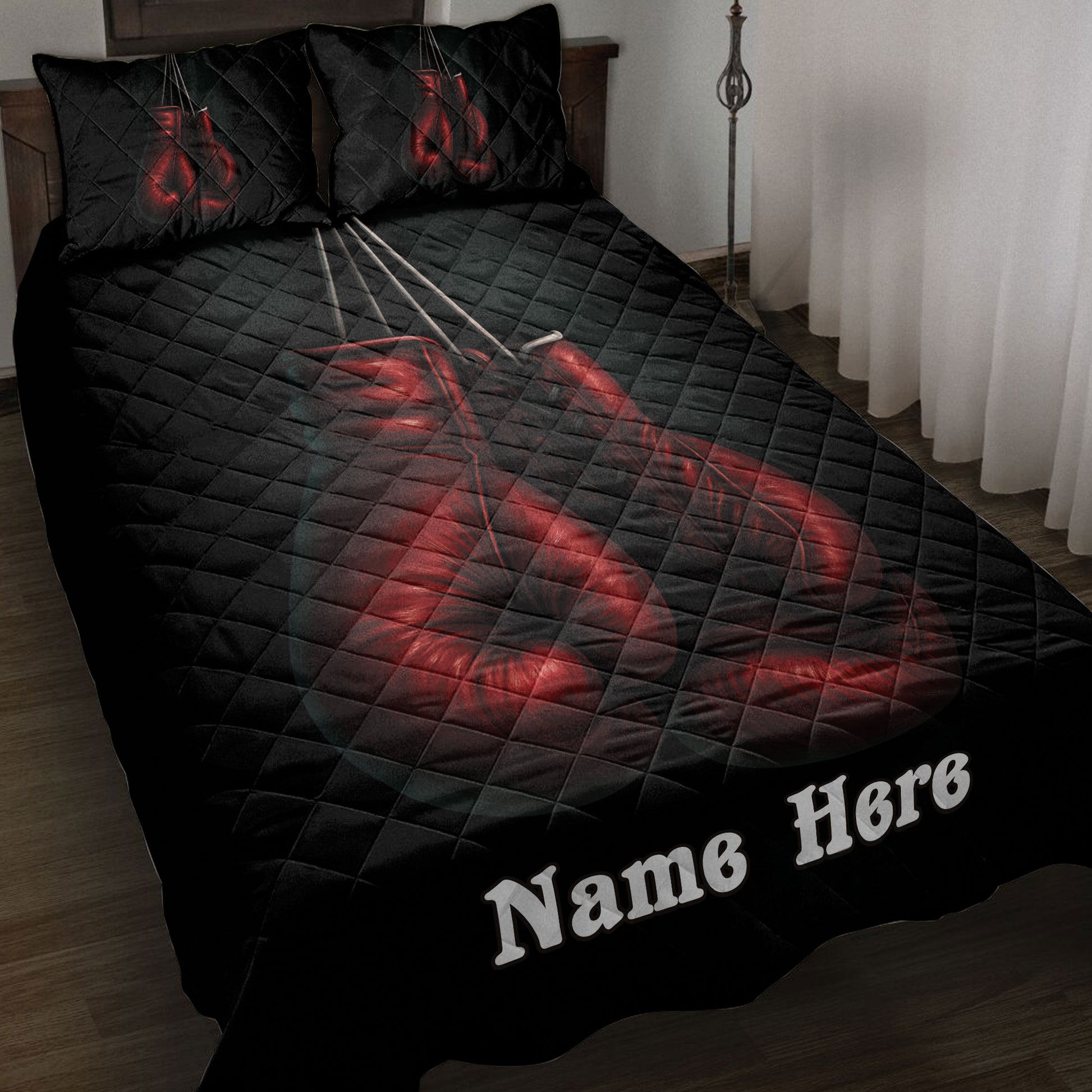 Black boxing quilt blanket displayed on a bed with dramatic red gloves and matching pillow artwork