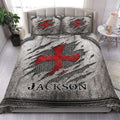 Knights Templar quilt blanket styled in a bright bedroom with dramatic red cross medieval artwork