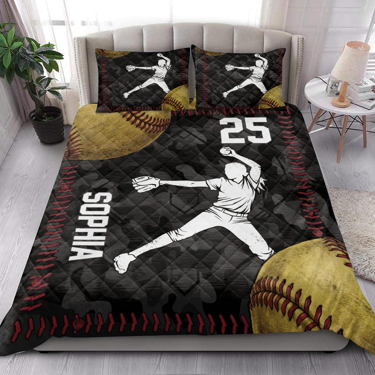 Softball quilt blanket styled in a bedroom with female pitcher artwork, softball graphics, and bold black and red accents