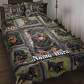 Rottweiler quilt blanket displayed on a bed with framed portraits of black and tan dogs