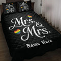 Black LGBTQ+ quilt blanket displayed on a bed with white Mrs. and Mrs. design and rainbow hearts