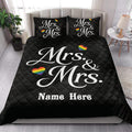 Black Mrs. and Mrs. LGBTQ+ quilt blanket styled in a bright bedroom with rainbow heart artwork