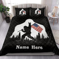 Bigfoot quilt bedding styled in a bedroom with black background, forest scenery, and American flag artwork
