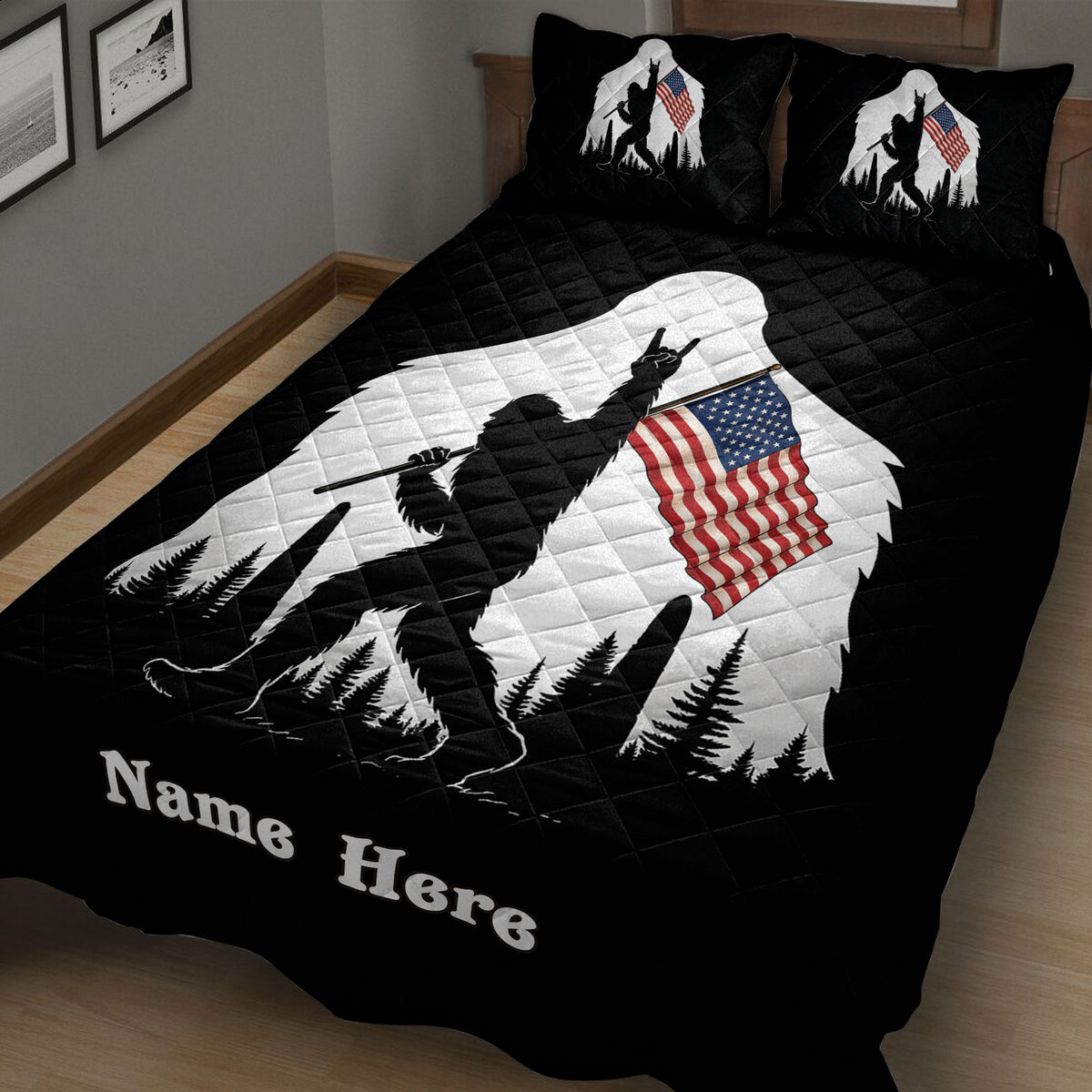 Close view of a black Bigfoot quilt blanket featuring woodland scenery and patriotic flag artwork