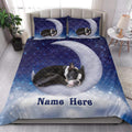 Boston Terrier quilt bedding styled in a bright bedroom with moon and star artwork