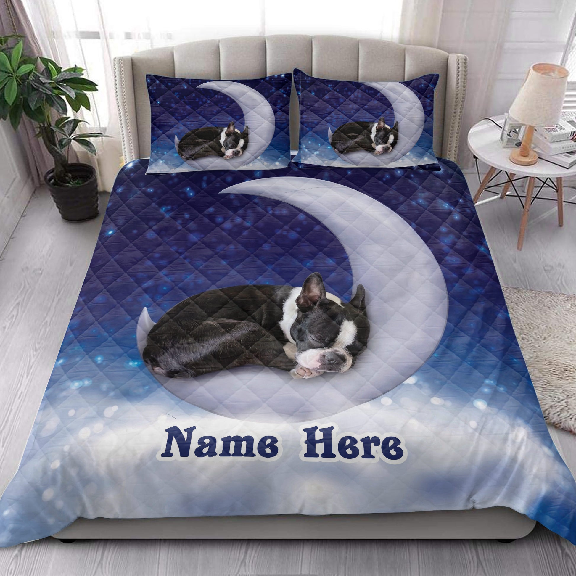 Boston Terrier quilt bedding styled in a bright bedroom with moon and star artwork