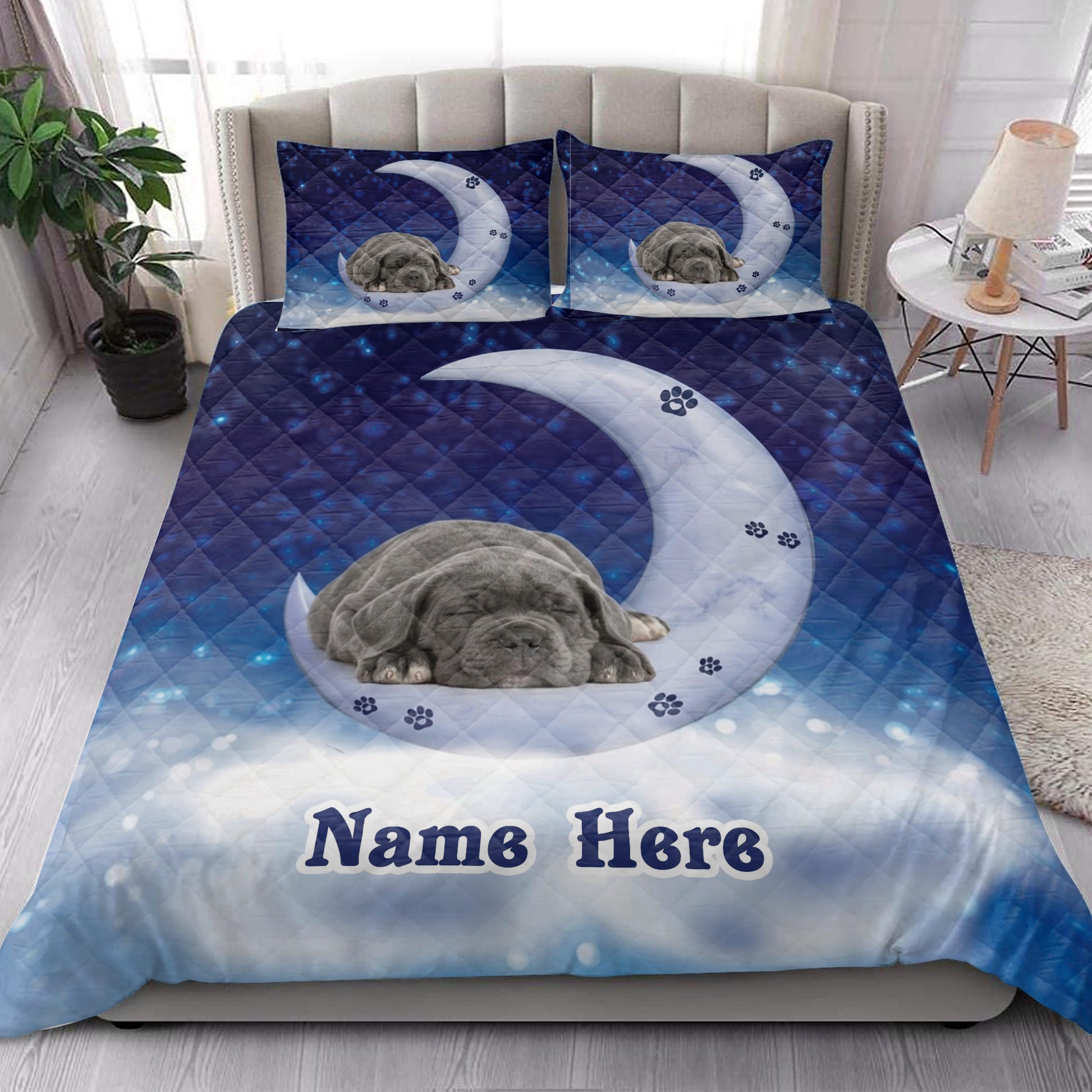 Cane Corso quilt bedding displayed on a modern bed with a sleeping dog beneath a crescent moon