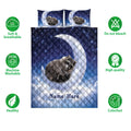 Raccoon quilt bedding set displayed with starry night artwork and coordinating moonlit pillow designs