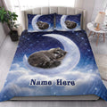 Raccoon quilt blanket styled on a bedroom bed with moon, clouds, stars, and nighttime artwork