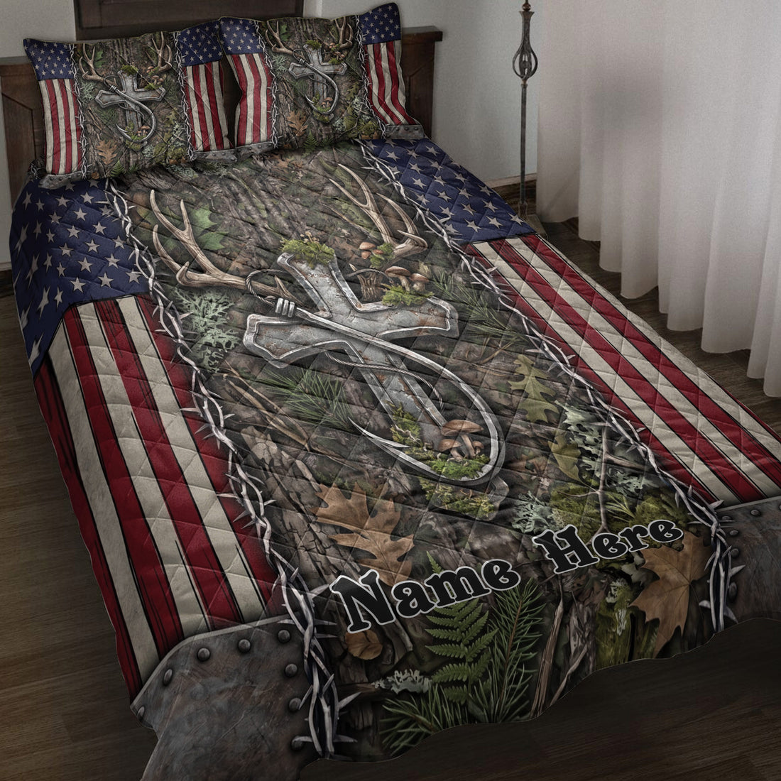Hunting quilt blanket displayed on a bed with deer antlers, camouflage foliage, and American flag accents