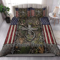 Hunting quilt blanket styled in a bright bedroom with deer antlers, camouflage leaves, and patriotic accents